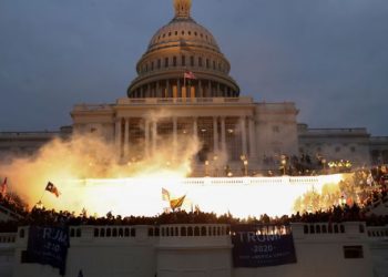 An explosion caused by a police munition is seen while supporters of U.S. President Donald Trump gather in front of the U.S. Capitol Building in Washington, U.S., January 6, 2021. REUTERS/Leah Millis     TPX IMAGES OF THE DAY