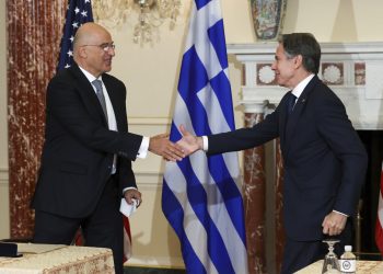 Secretary of State Antony Blinken and Greece's Foreign Minister Nikos Dendias shake hands after signing the renewal of the U.S.-Greece Mutual Defense Cooperation Agreement at the State Department in Washington, Thursday, Oct. 14, 2021. (Jonathan Ernst/Pool via AP)