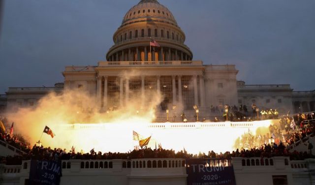 An explosion caused by a police munition is seen while supporters of U.S. President Donald Trump gather in front of the U.S. Capitol Building in Washington, U.S., January 6, 2021. REUTERS/Leah Millis     TPX IMAGES OF THE DAY