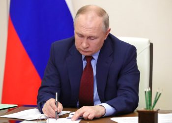 Russian President Vladimir Putin attends a meeting on the development of agricultural and fishing industries via videoconference at the Novo-Ogaryovo state residence outside Moscow, Russia, Tuesday, April 5, 2022. (Mikhail Klimentyev, Sputnik, Kremlin Pool Photo via AP)