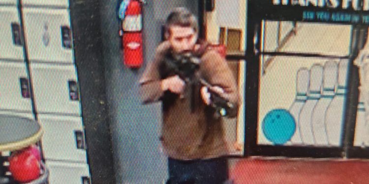 This handout image released on October 25, 2023 by the Androscoggin County Sheriff's Office via Facebook shows a photo of the armed suspect in a shooting as law enforcement in Androscoggin County investigate "two active shooter events" in Lewiston, Maine. At least 10 people were killed and dozens injured in shootings in the city of Lewiston, Maine October 25, 2023 night, US media reported, with police saying that the gunman was still at large. The death toll was reported to be as high as 16 by CNN and the Wall Street Journal, in the shooting spree that took place at a bowling alley and also at least one other location, a local restaurant and bar, according to media. (Photo by Androscoggin County Sheriff's Office / AFP) / RESTRICTED TO EDITORIAL USE - MANDATORY CREDIT "AFP PHOTO / Androscoggin County Sheriff's Office " - NO MARKETING - NO ADVERTISING CAMPAIGNS - DISTRIBUTED AS A SERVICE TO CLIENTS