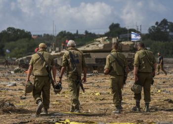 Israeli soldiers gather in a staging area near the border with Gaza Strip, in southern Israel, Thursday, Oct. 19, 2023. (AP Photo/Tsafrir Abayov)