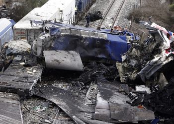 Debris of trains lie on the rail lines after a collision in Tempe, about 376 kilometres (235 miles) north of Athens, near Larissa city, Greece, Wednesday, March 1, 2023. A passenger train carrying hundreds of people, including many university students returning home from holiday, collided at high speed with an oncoming freight train before midnight on Tuesday.  (AP Photo/Giannis Papanikos)