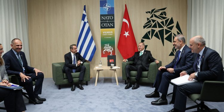 Turkish President Tayyip Erdogan and Greek Prime Minister Kyriakos Mitsotakis, accompanied by foreign ministers Hakan Fidan of Turkey and Giorgos Gerapetritis of Greece, meet during a NATO leaders summit in Vilnius, Lithuania July 12, 2023. Murat Cetinmuhurdar/Turkish Presidential Press Office/Handout via REUTERS ATTENTION EDITORS - THIS PICTURE WAS PROVIDED BY A THIRD PARTY. NO RESALES. NO ARCHIVES.