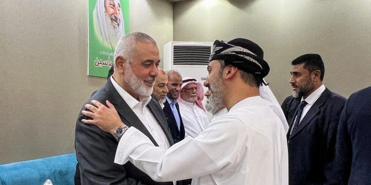 Ismail Haniyeh, top leader of the Palestinian Islamist group Hamas, meets a person offering condolences after the killing of three of his sons in an Israeli strike in Gaza City, in Doha, Qatar April 11, 2024. REUTERS/Ibraheem Abu Mustafa