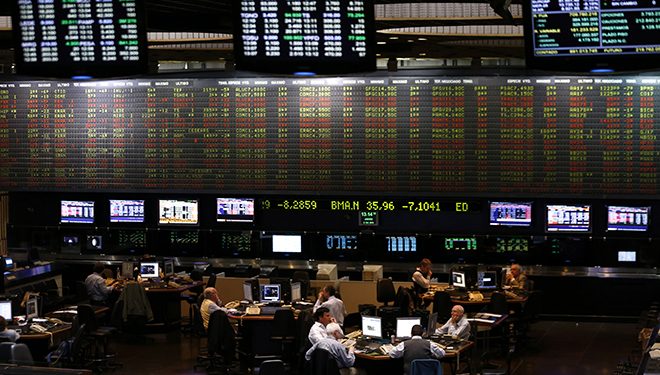 Traders work on the floor of the Buenos Aires Stock Exchange, October 2, 2014. Argentine stocks and bonds fell sharply on Thursday as the government left markets guessing about policy direction after the appointment of a new central bank chief viewed as sympathetic to the government's ramped-up interventions in the economy. 
  REUTERS/Marcos Brindicci (ARGENTINA - Tags: POLITICS BUSINESS) - RTR48QFO