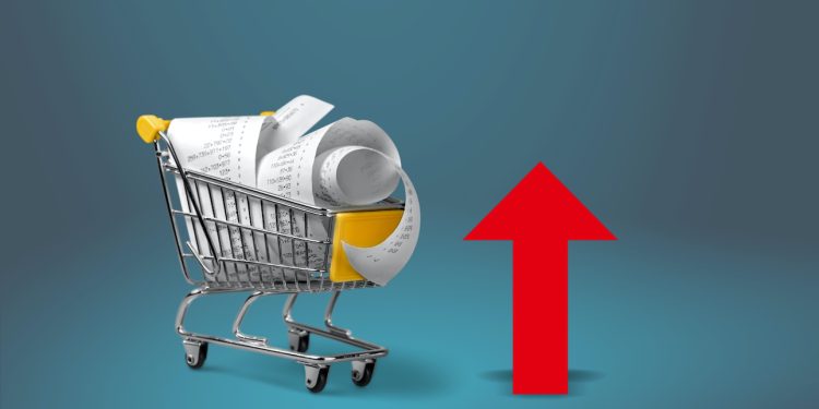 Shopping cart with cardboard boxes and red up arrow. Growth wholesale and retail. Improving consumer sentiment, economic growth. Rising prices for goods, inflation. growth of popularity of the product