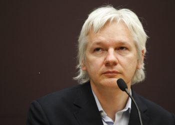 WikiLeaks founder Julian Assange listens during a news conference in central London, Thursday, Dec. 1, 2011. The whistle-blowing website has released details of companies it says are selling information obtained by monitoring people's mobile phones and computers. According to Assange, more than 150 organizations around the world have the ability to use phones as tracking devices as well as intercept messages and listen to calls. (AP Photo/Lefteris Pitarakis)