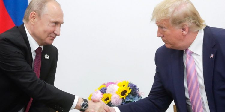 epa07679921 A handout picture made available on official website of President of Russia, shows Russian President Vladimir Putin (L) shaking hands with US President Donald J. Trump (R) during their meeting on the sidelines of the G20 summit in Osaka, Japan, 28 June 2019. In the first time Japan hosts a G20 summit. The summit gathers leaders from 19 countries and the European Union to discuss topics such as global economy, trade and investment, innovation and employment.  EPA/RUSSIAN PRES. PRESS OFFICE / HANDOUT  HANDOUT EDITORIAL USE ONLY/NO SALES