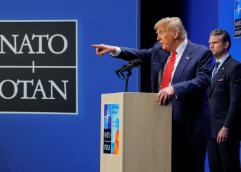 U.S. President Donald Trump speaks at a press conference, as Secretary of Defense Pete Hegseth stands, at the NATO summit in The Hague, Netherlands, June 25, 2025. REUTERS/Brian Snyder